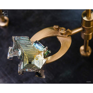 Magnifying glass on stand with bismuth